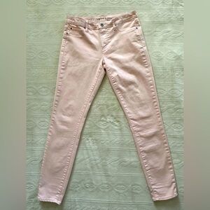 Baby pink slim fit jeans.